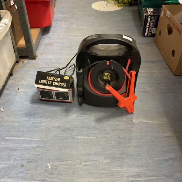 Professional jump starter with cables and analyzer for car batteries.