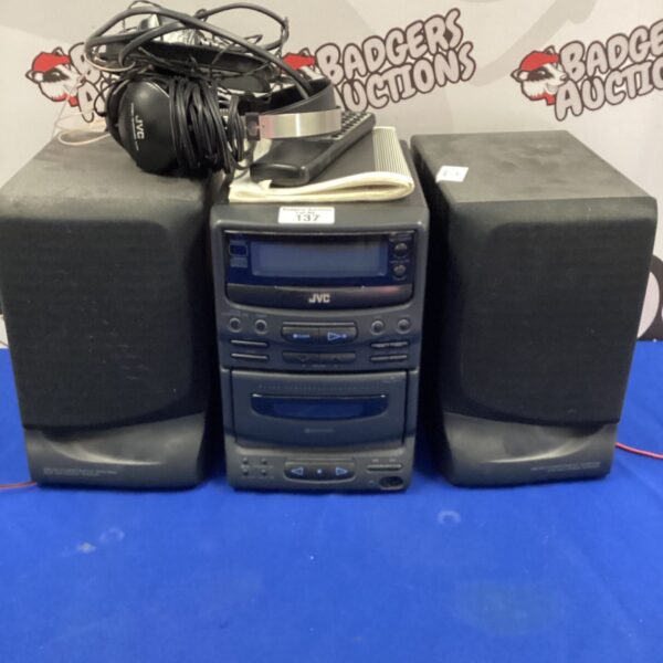 JVC mini hifi system with remote control and speakers.