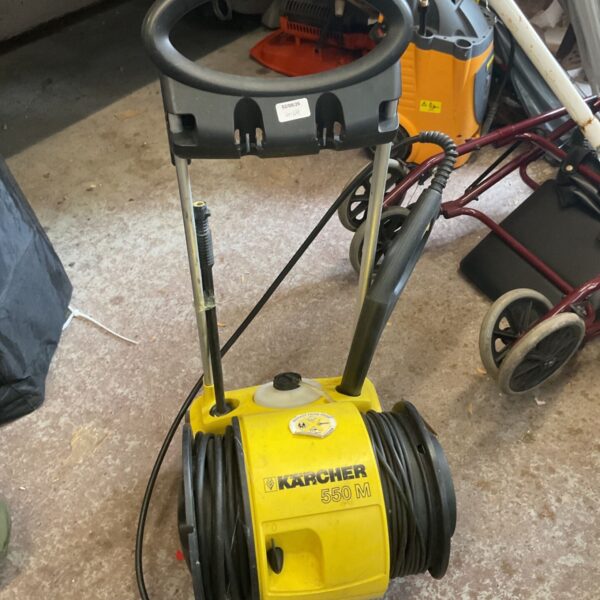 Used Karcher 550m pressure washer with hose and wheels.