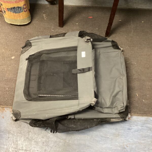 Grey KCT pet carrier crate for cats and dogs, showing wear.