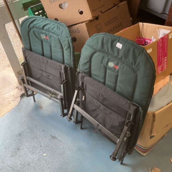 Pair of green Keenets carp fishing seats with folding frames.