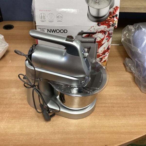 White and grey Kenwood electric hand mixer, vintage kitchen appliance.