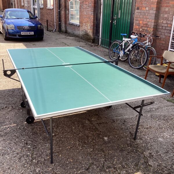 Green Kettler table tennis table in an outdoor setting.