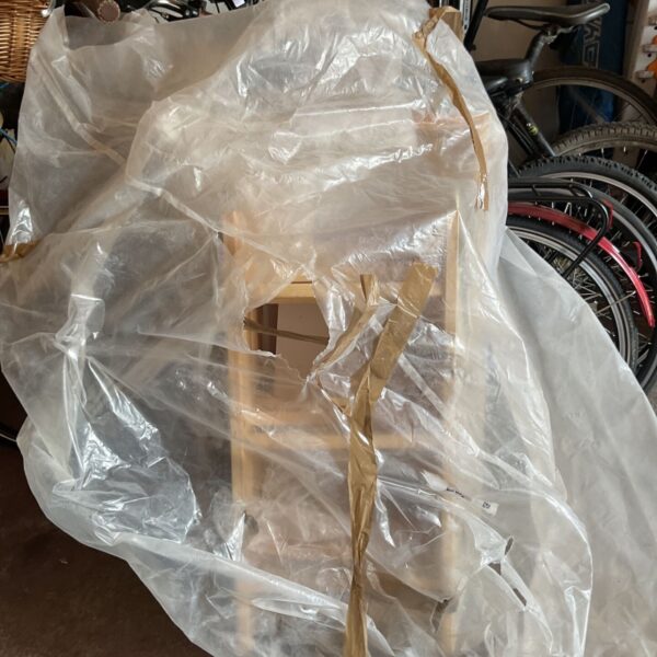 Keylite loft ladder kit KYL 04 covered in plastic sheeting.