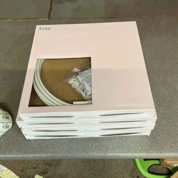Four packs of Kias plastic curtain coil racks in original packaging.