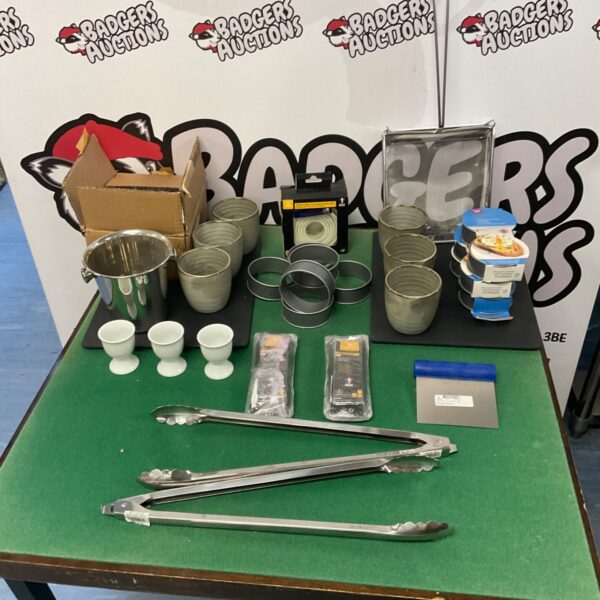 Kitchen utensil lot featuring stainless steel egg poaching rings and bowls.