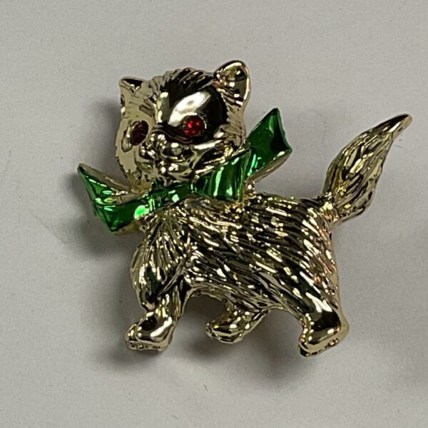 Vintage gold kitten brooch with green enamel details.