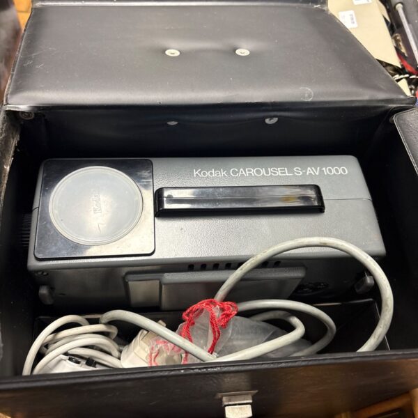 Vintage Kodak Carousel S-AV 1000 slide projector in its case.