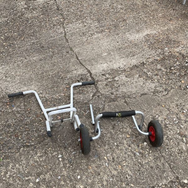 Red rubber wheels on a metal ladder standoff for stability.