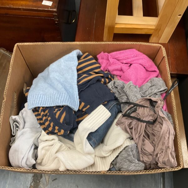 Box of ladies clothing including jumpers and knitwear.