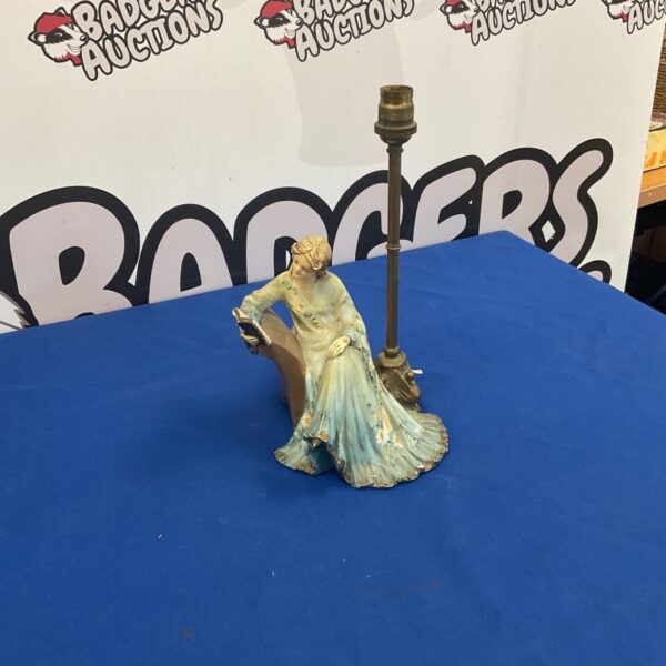 Vintage lady reading table lamp with ceramic base.