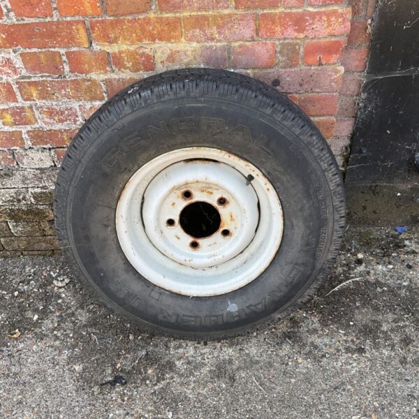 Land Rover Defender wheel and General Grabber tire setup.