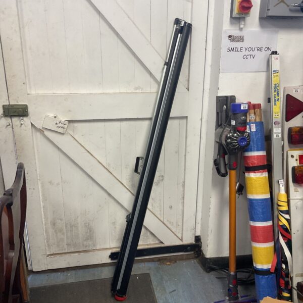 Large folding projector screen in a workshop setting.