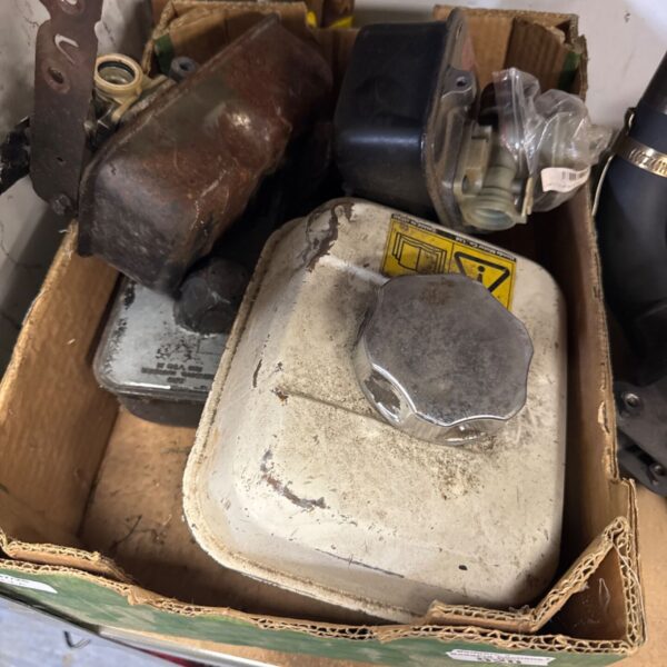 Selection of plastic lawnmower fuel tanks for garden machinery repair.