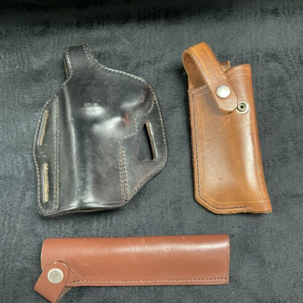 Vintage leather pistol holster, dark brown, with belt loop.