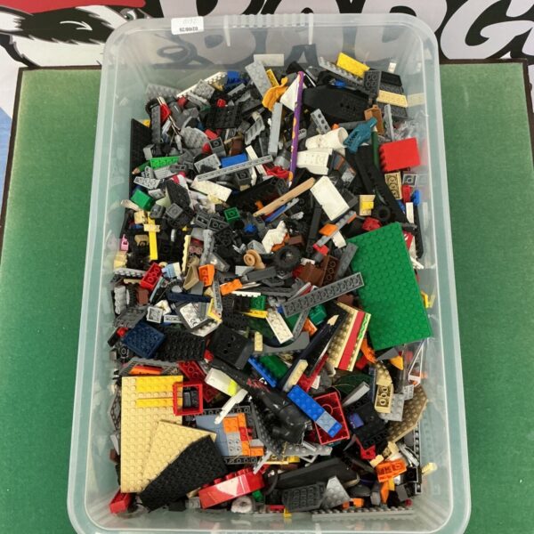 Box of assorted Lego pieces for building and creative play.