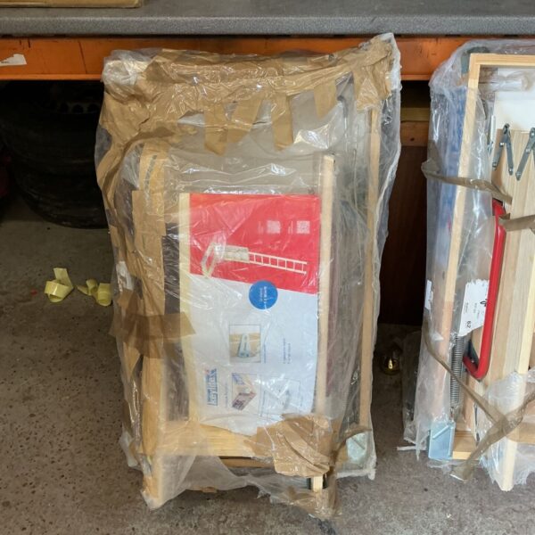 Wooden loft hatch measuring 600x1000mm, ready for installation.
