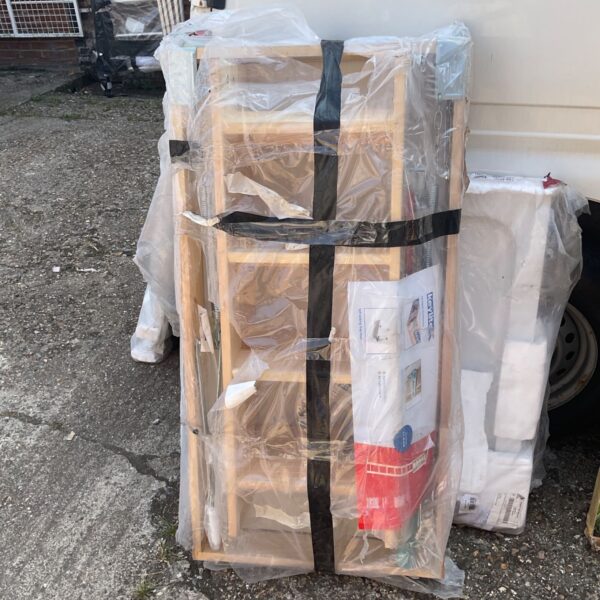 Wooden loft hatch measuring 600x1200mm, wrapped in plastic.
