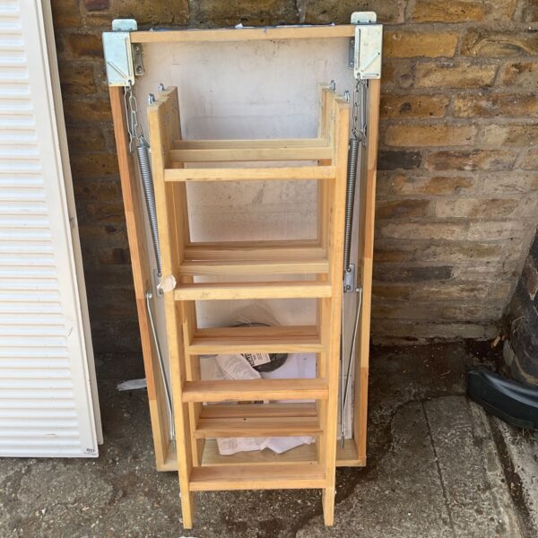 Wooden folding loft hatch for attic access.