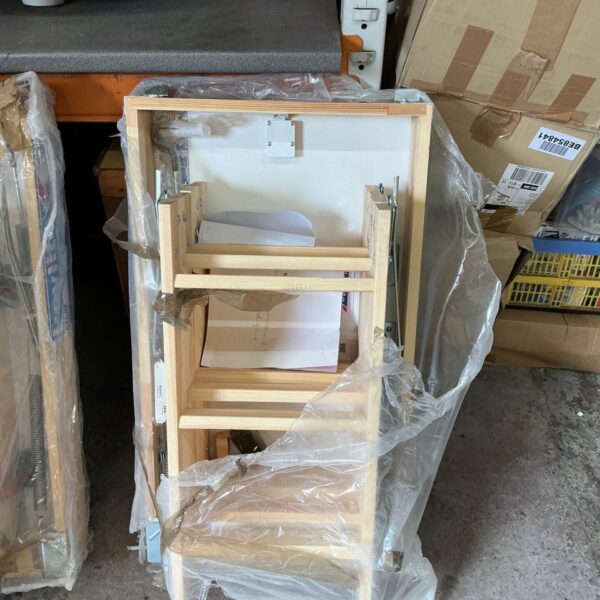 Wooden loft hatch panel for attic access.