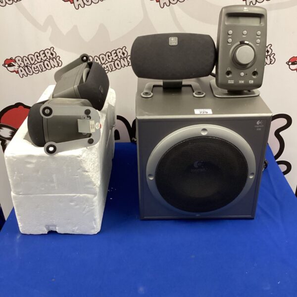 Logitech THX subwoofer for surround sound system, showing wear.
