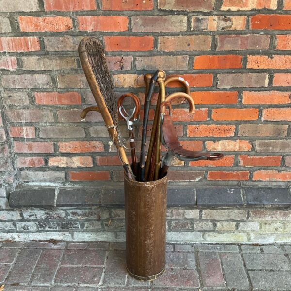 Vintage stick stand with various sticks inc lacrosse, shooting stick & others
