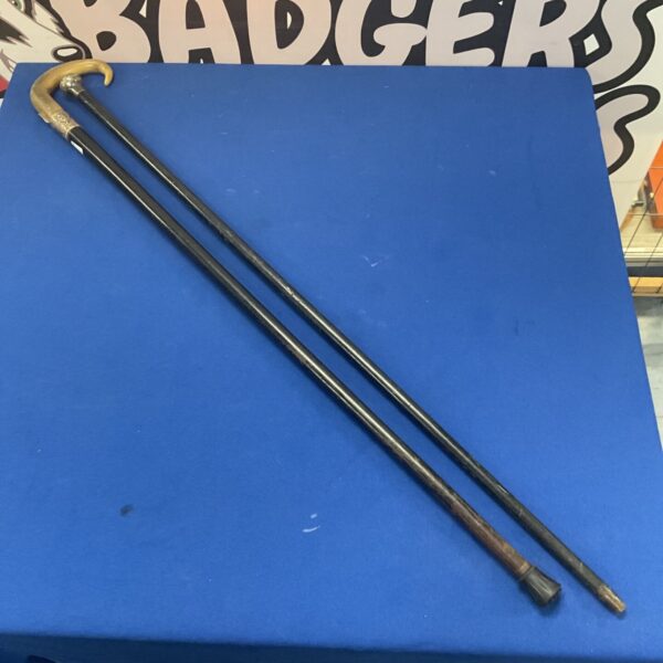 Hallmarked silver topped walking cane with a horn topped walking stick with silver band (hallmarks have rubbed off)