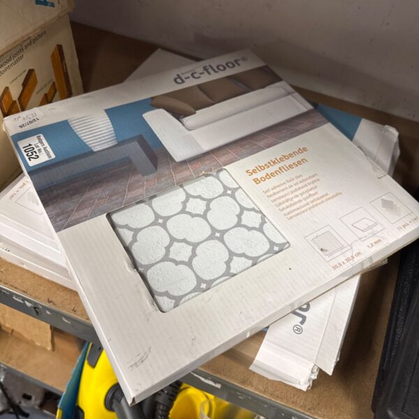 Four packs of 30.5cm x 30.5cm x 1.2mm self adhesive floor tiles