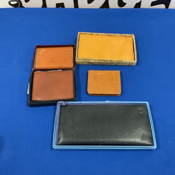Dunhill leather cigarette case and four leather wallets