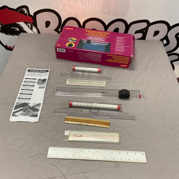 Assorted paper trimmers and rulers