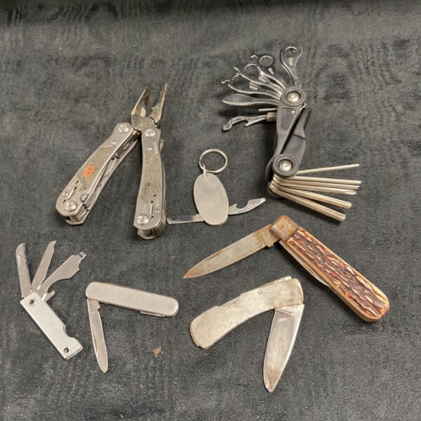 Two multi tools inc gerber and five pocket knives