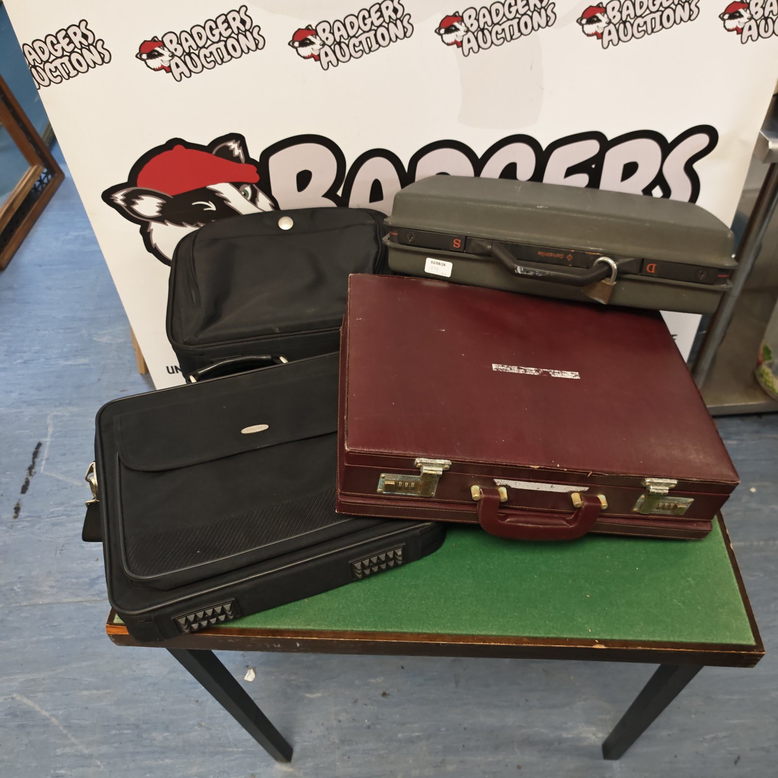 Samsonite briefcase with one burgundy leather briefcase and two laptop bags