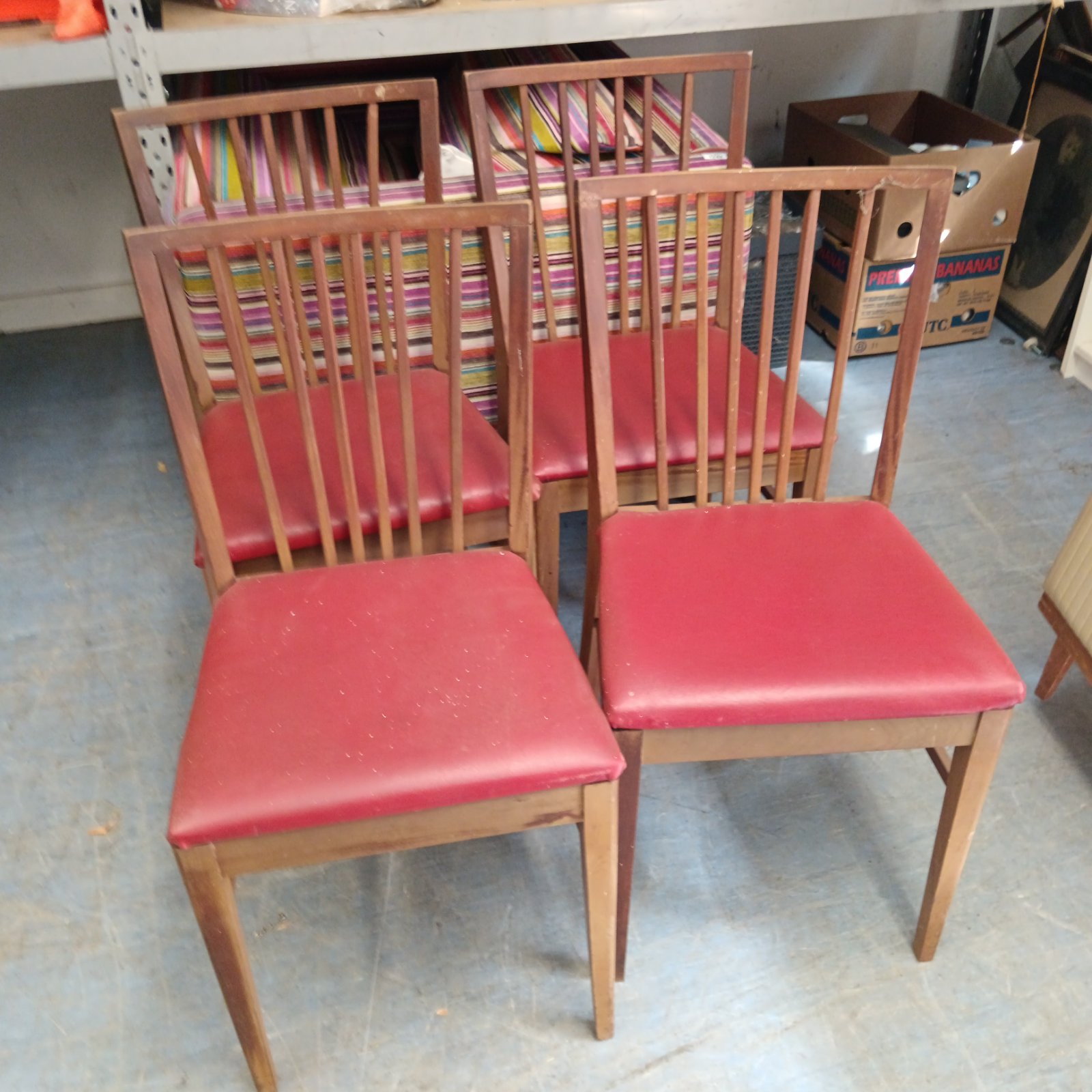 Four vintage stick back dining chair with red leather seats & extending dining room table