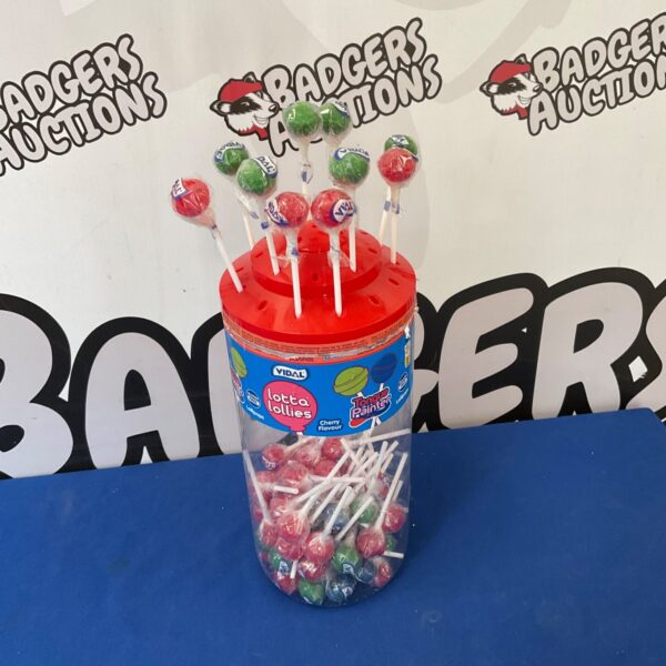Vintage Lotta Lollies holder filled with colourful lollies.
