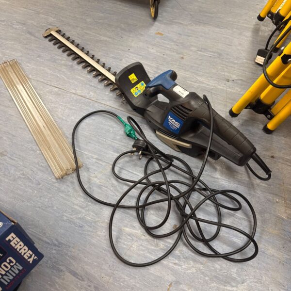 Macallister electric chainsaw with cable, garden tool for cutting wood.