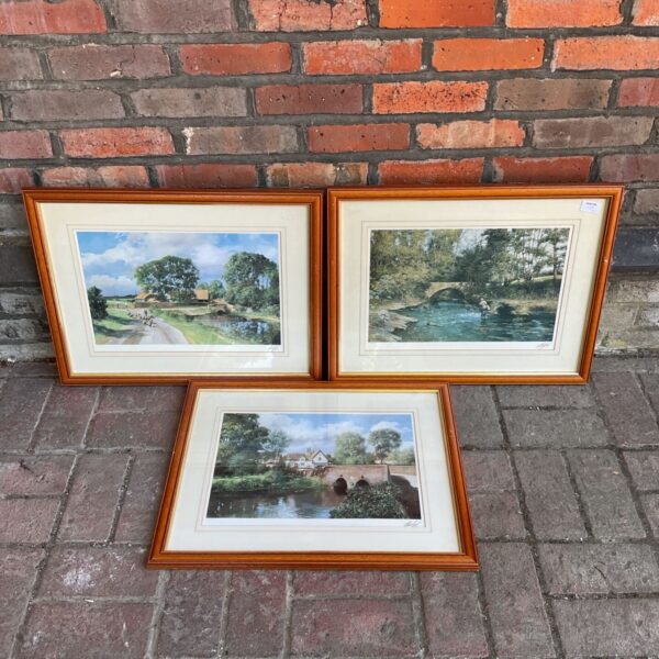 Signed Madwick river scene print in maple frame.
