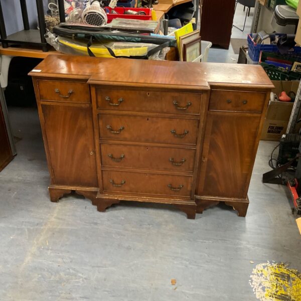 Antique mahogany breakfront cabinet with drawers, vintage furniture.