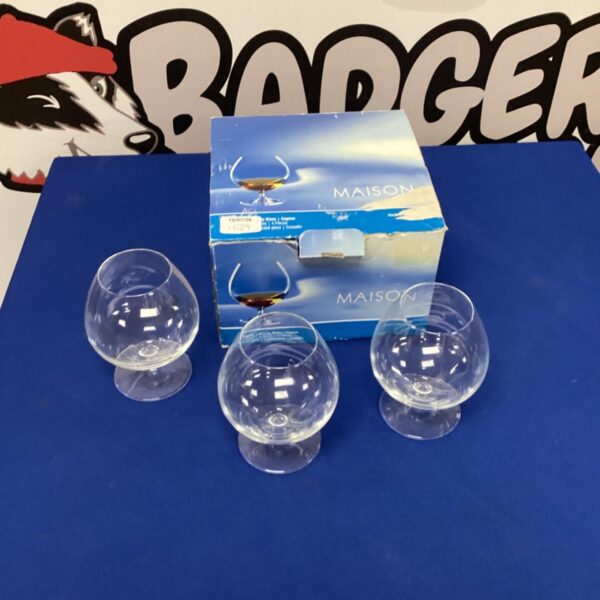 Three vintage Maison brandy glasses for enjoying spirits.