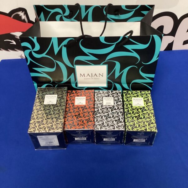 Four unused Majan perfume boxes with a geometric pattern.
