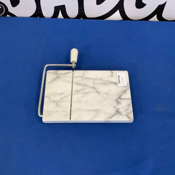 White marble cheese board with grey veining for serving food.