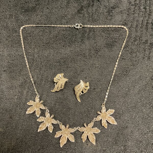 Vintage marcasite cannabis leaf necklace and earrings set.