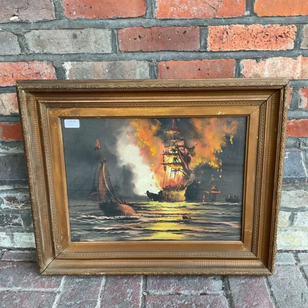 Antique marine oil painting of a burning manowar ship with gilt frame.