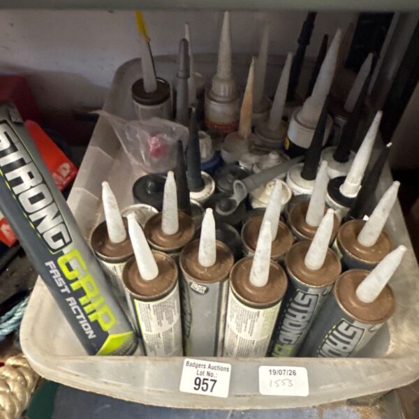 Assorted tubes of mastic and silicone sealant for DIY projects.