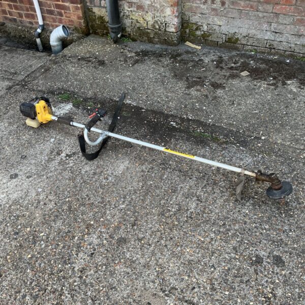 Vintage McCulloch Super Mac 26 petrol strimmer for garden use.