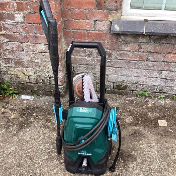 McGregor electric pressure washer with cleaning attachments for garden use.