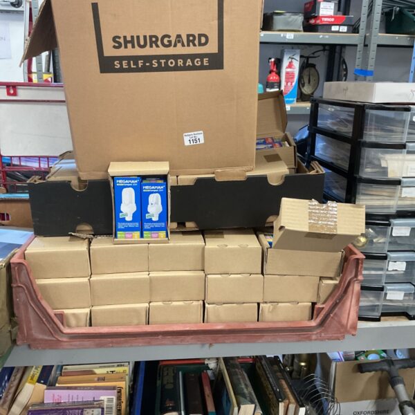 Job lot of Megaman light bulbs in original packaging, stacked for storage.