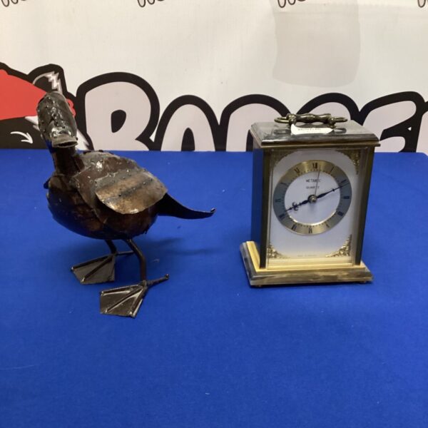 Vintage Metamec carriage clock and metal duck sculpture.