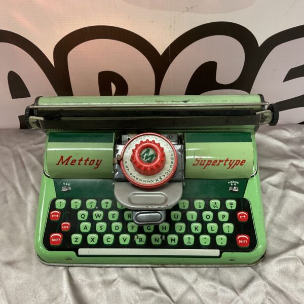 Vintage Mettoy tin plate typewriter, a collectible retro toy.