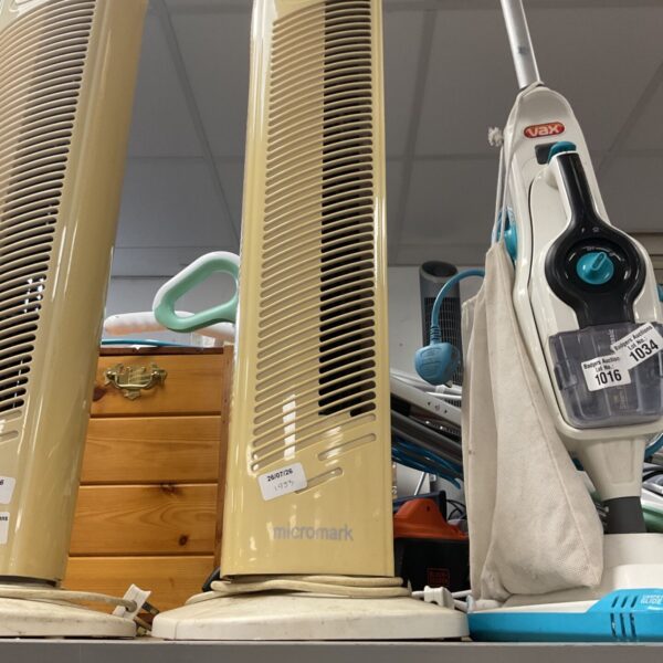 Beige Micromark tower fan in used condition.