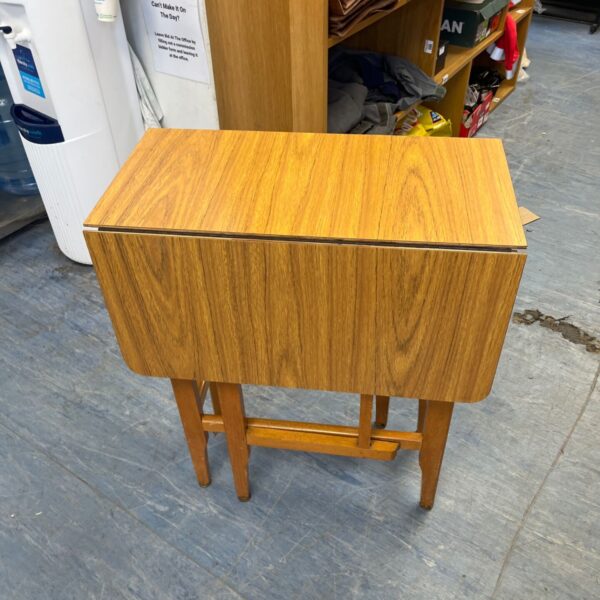 Vintage mid-century drop leaf table with Formica top.
